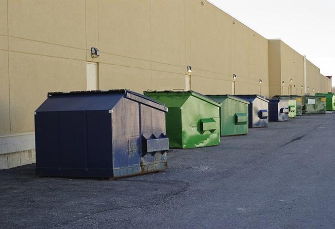 a crowd of dumpsters of all colors and sizes at a construction site in East Wareham MA